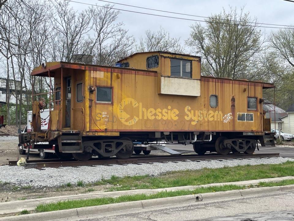 The yellow Chessie System caboose sits on its permanent home