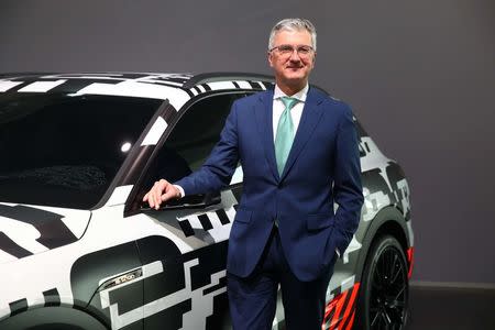 Audi CEO Rupert Stadler poses next to the Audi Q7 e-tron quatro car before the company's annual news conference in Ingolstadt, Germany March 15, 2018. REUTERS/Michael Dalder