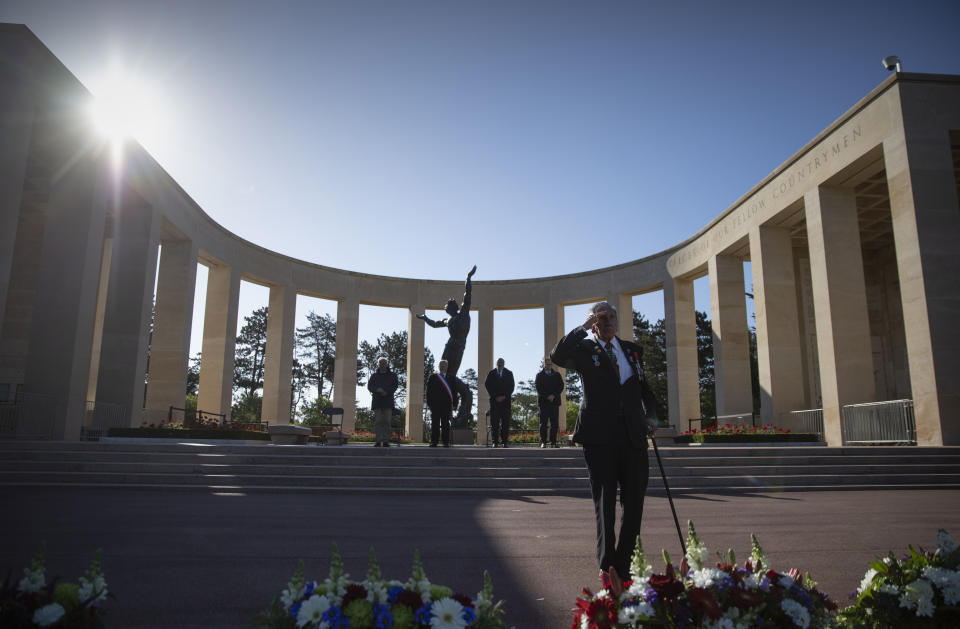 Charles Norman Shay, D-Day WWII veteran and Penobscot Elder from Maine, salutes after laying a wreath during a D-Day 76th anniversary ceremony at the Normandy American Cemetery in Colleville-sur-Mer, Normandy, France, Saturday, June 6, 2020. Due to coronavirus measures many ceremonies and memorials have been cancelled in the region with the exception of very small gatherings. (AP Photo/Virginia Mayo)