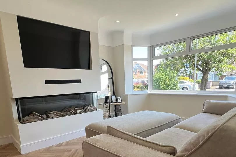 The herringbone flooring and media wall look incredible