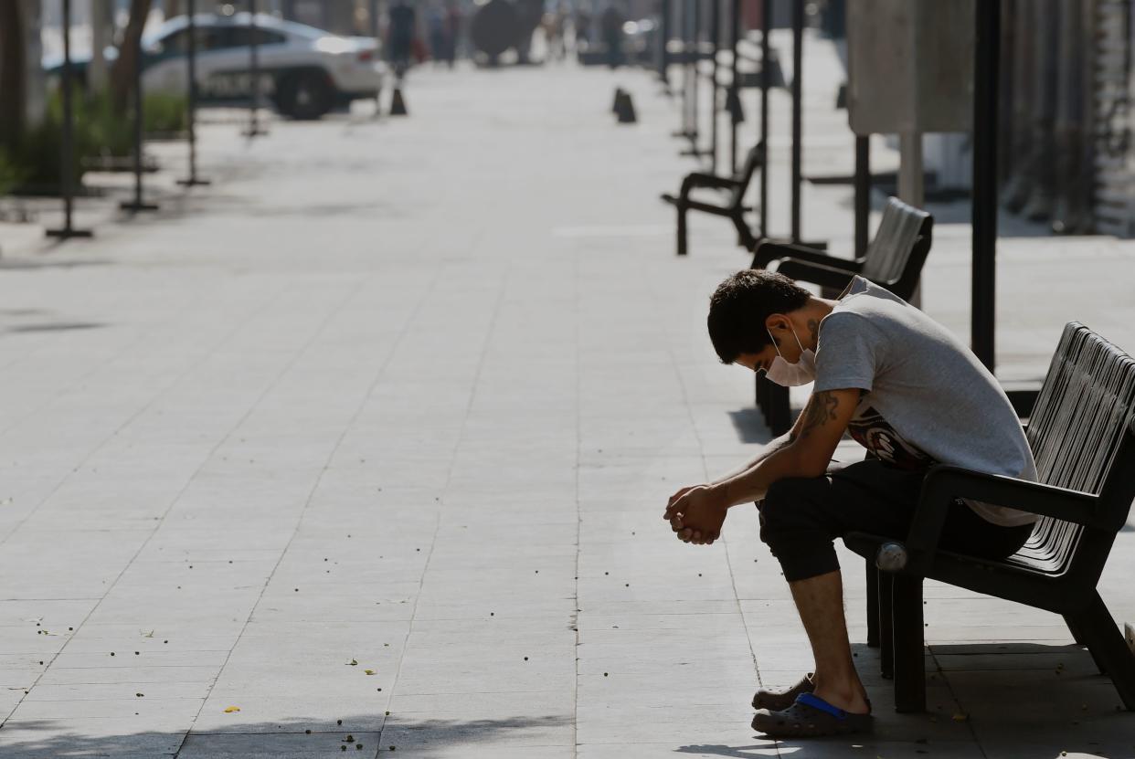 A man rest at the Juarez avenue during the outbreak of the novel coronavirus, COVID-19, in Mexico City on April 5, 2020. (Photo by ALFREDO ESTRELLA / AFP) (Photo by ALFREDO ESTRELLA/AFP via Getty Images)