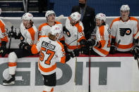 Philadelphia Flyers right wing Wade Allison (57) celebrates his goal with his teammates during the second period of an NHL hockey game against the Washington Capitals, Friday, May 7, 2021, in Washington. (AP Photo/Alex Brandon)