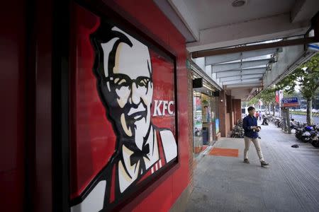 A customer walks out of a KFC restaurant in Shanghai, China, October 9, 2015. REUTERS Aly Song