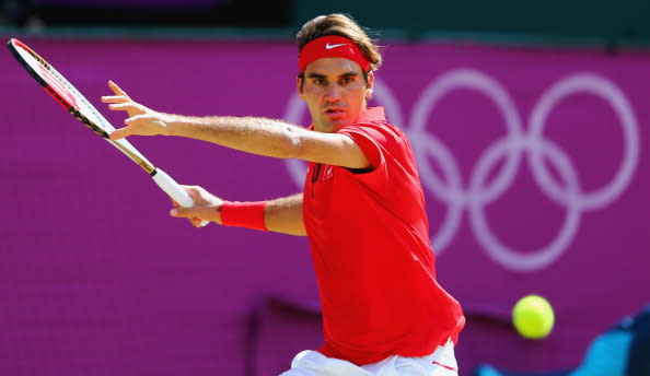 LONDON, ENGLAND - AUGUST 05: Roger Federer of Switzerland plays a shot against Andy Murray of Great Britain during the Men's Singles Tennis Gold Medal Match against Andy Murray of Great Britain on Day 9 of the London 2012 Olympic Games, at the All England Lawn Tennis and Croquet Club on August 5, 2012 in London, England. (Photo by Amin Mohammad Jamali/Gallo Images/Getty Images)