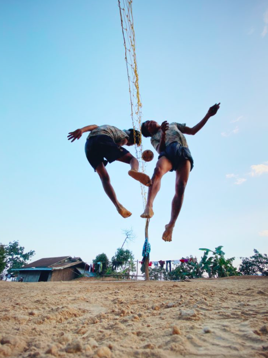 2nd place – Children: 'ChinLone' was taken by Dan Liu from China in Myanmar, and shows children at play on a beach.