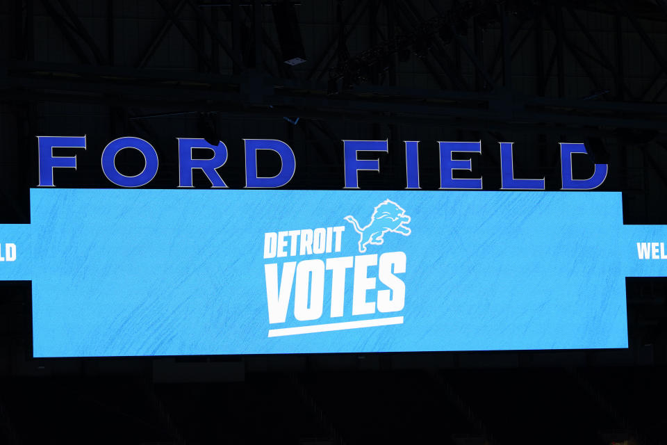 "Detroit Votes" is displayed on the Ford Field scoreboard, Tuesday, Nov. 3, 2020, in Detroit. Michigan Secretary of State Jocelyn Benson cast her vote in a drop box at the Detroit Pistons' training facility and about 12 hours later, she witnessed ballots being rolled into Ford Field for a double-checking step of the election process. (AP Photo/Carlos Osorio)