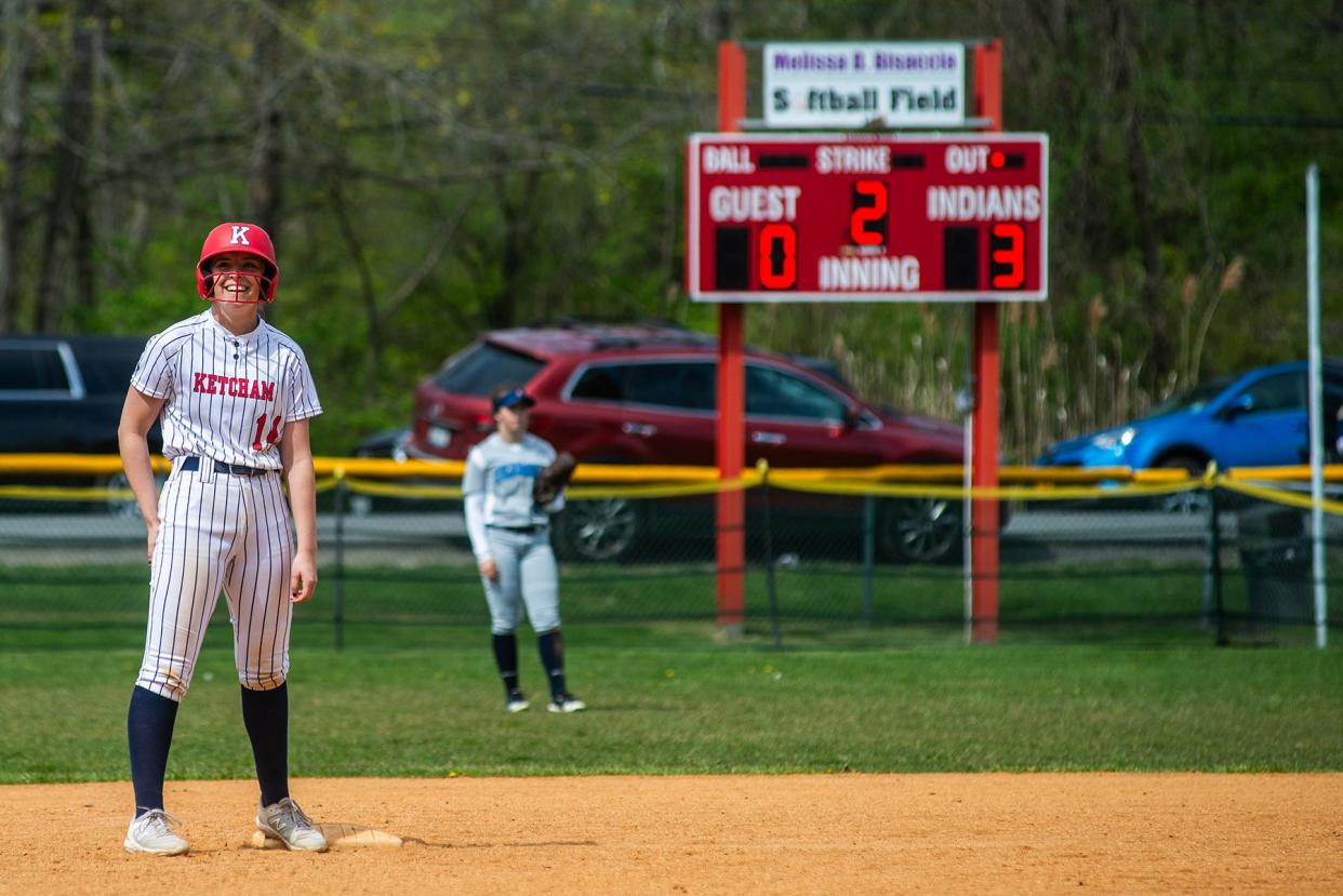 Ketcham's Jenny Nardelli, left, smiles after landing on second base during the Bisaccia Softball Tournament in Wappingers Falls, NY on Saturday, April 27, 2024.