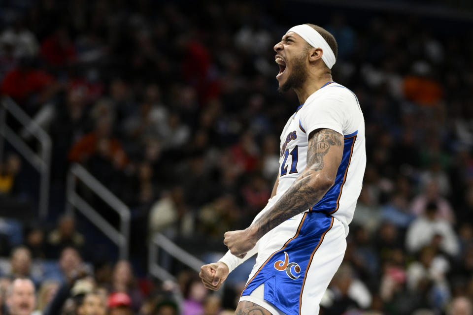 Washington Wizards center Daniel Gafford celebrates during the first half of the team's NBA basketball game against the Miami Heat, Friday, April 7, 2023, in Washington. (AP Photo/Nick Wass)