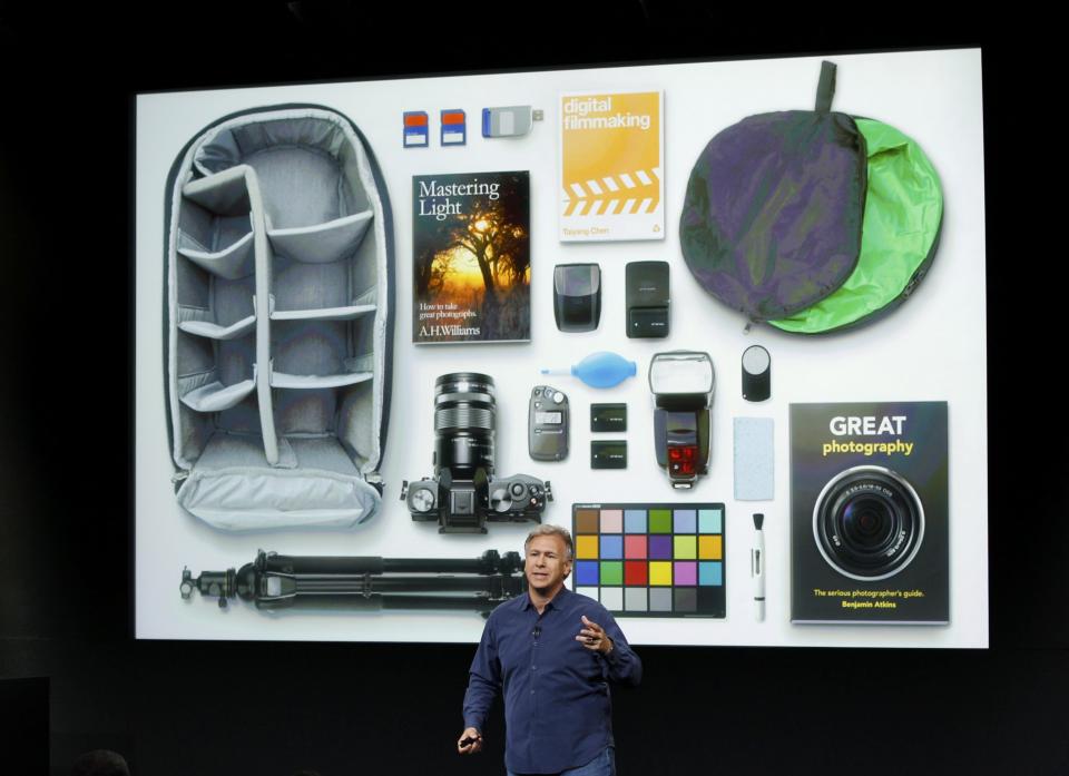 REFILE - CORRECTING NAME AND POSITION OF SPEAKER Phil Schiller, senior vice president of worldwide marketing for Apple Inc, talks about the camera in the new iPhone 5S during Apple Inc's media event in Cupertino, California September 10, 2013. REUTERS/Stephen Lam (UNITED STATES - Tags: BUSINESS SCIENCE TECHNOLOGY BUSINESS TELECOMS)