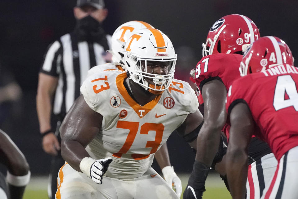 FILE - Tennessee offensive lineman Trey Smith (73) blocks against Georgia in the second half of an NCAA college football game in Athens, Ga., in this Saturday, Oct. 10, 2020, file photo. Tennessee guard Trey Smith says he has no problem explaining his situation, even a million times if he must. He played college football while dealing with a condition that can cause blood clots, and Smith says it’s unique. But he wants to play in the NFL, so he has no problem detailing the plan his doctors and specialists put together allowing him to do just that. (AP Photo/John Bazemore, File)