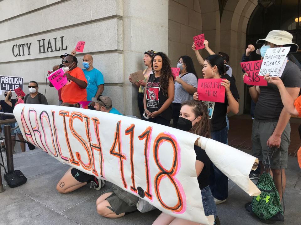 Protesters oppose the anti-encampment law outside City Hall in downtown Los Angeles.