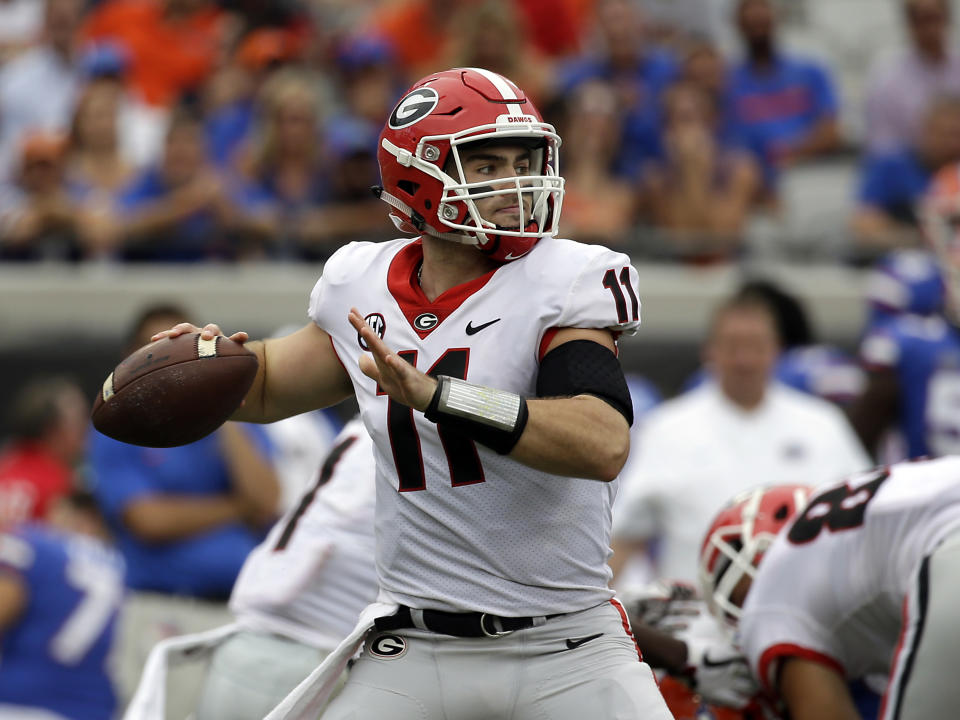 Georgia quarterback Jake Fromm throws a pass against Florida in the first half of an NCAA college football game, Saturday, Oct. 28, 2017, in Jacksonville, Fla. (AP Photo/John Raoux)