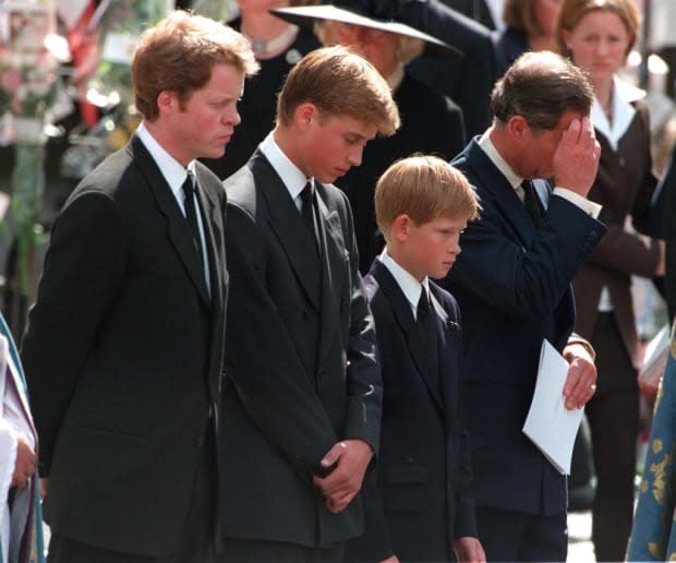 <p>Looking on as Diana's coffin is carried up the steps to the cathedral in which her funeral will take place.</p>