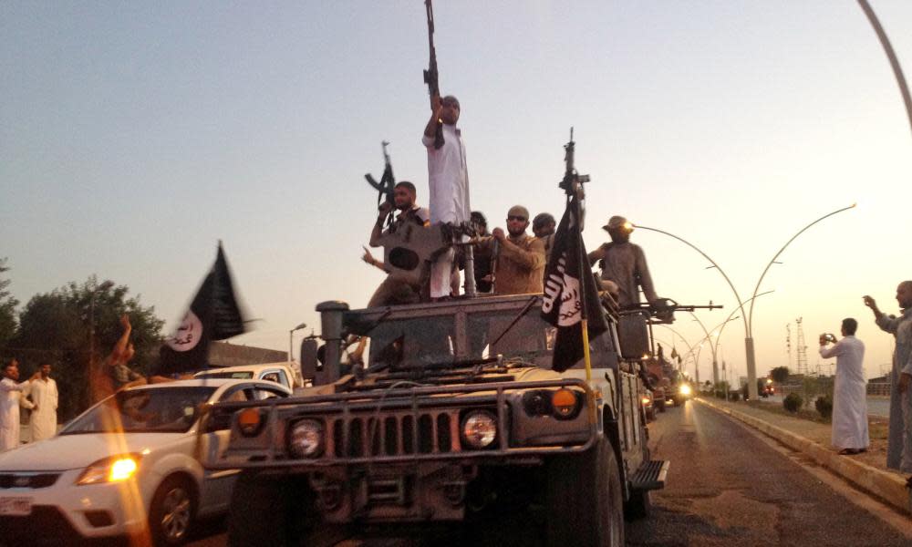  Islamic State fighters on the main road in Mosul in 2014.