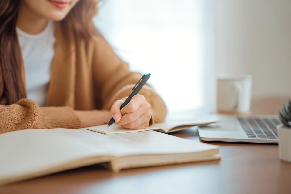 Young woman studying at home