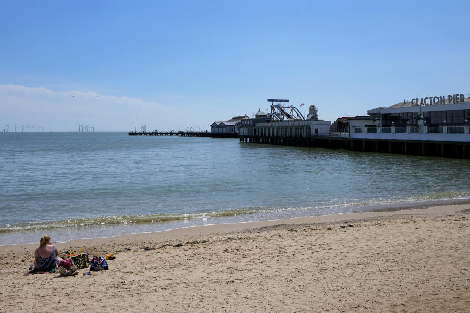 A view of the pier and beach in Clacton-On-Sea, England, Friday, June 21, 2024. Many in the town feel a deep sense of disillusionment with the governing Conservatives, and some are considering voting for the anti-immigration Reform UK party in next week's national election. (AP Photo/Kirsty Wigglesworth)
