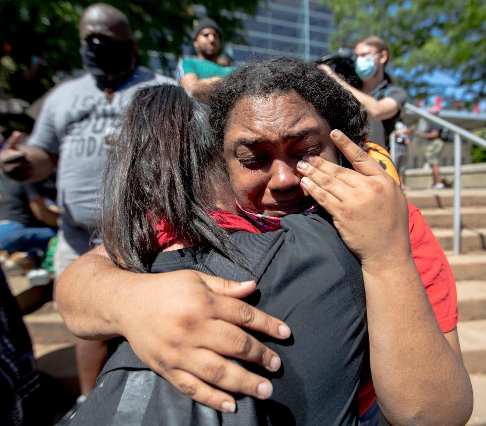 Dzemila Hamzabegovic hugs Courtney Artis on Sunday, May 31, 2020, during a Black Lives Matter healing rally in front of KFC Yum! Center in downtown Louisville. The two were complete strangers before the event and embraced as they were overcome with emotion. "For white people to think about us, it's powerful. It's emotional," Artis said. "Don't hurt us. We won't hurt you."