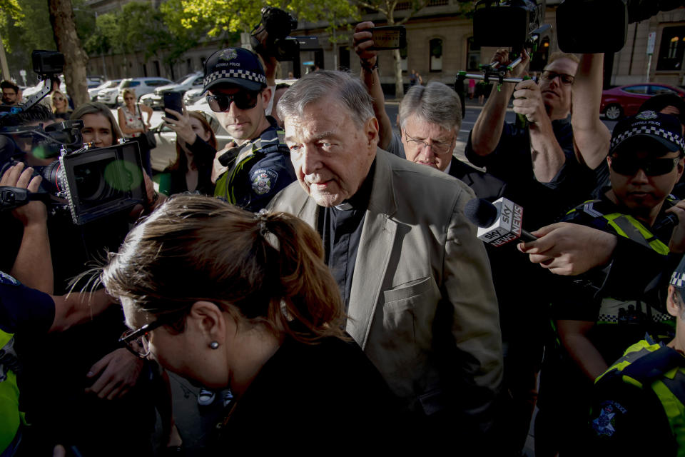 FILE - In this Feb. 27, 2019, file photo, Cardinal George Pell arrives at the County Court in Melbourne, Australia. Pell was sentenced in an Australian court on Wednesday, March 13, 2019 to 6 years in prison for molesting two choirboys in a Melbourne cathedral more than 20 years ago. (AP Photo/Andy Brownbill, File)