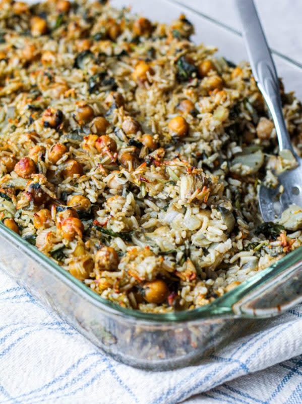 <p>Upbeet Kitchen</p><p>This vegan, gluten-free chickpea brown rice spinach artichoke casserole incorporates the beloved spinach-artichoke combination into a grounding, nourishing vegan casserole that sticks to your ribs and is guaranteed to warm you right up.</p><p><strong>Get the recipe: <a href="https://upbeetkitchen.com/2020/09/13/chickpea-brown-rice-spinach-artichoke-casserole-vegan/" rel="nofollow noopener" target="_blank" data-ylk="slk:Chickpea Brown Rice Spinach Artichoke Casserole;elm:context_link;itc:0;sec:content-canvas" class="link ">Chickpea Brown Rice Spinach Artichoke Casserole</a></strong></p>