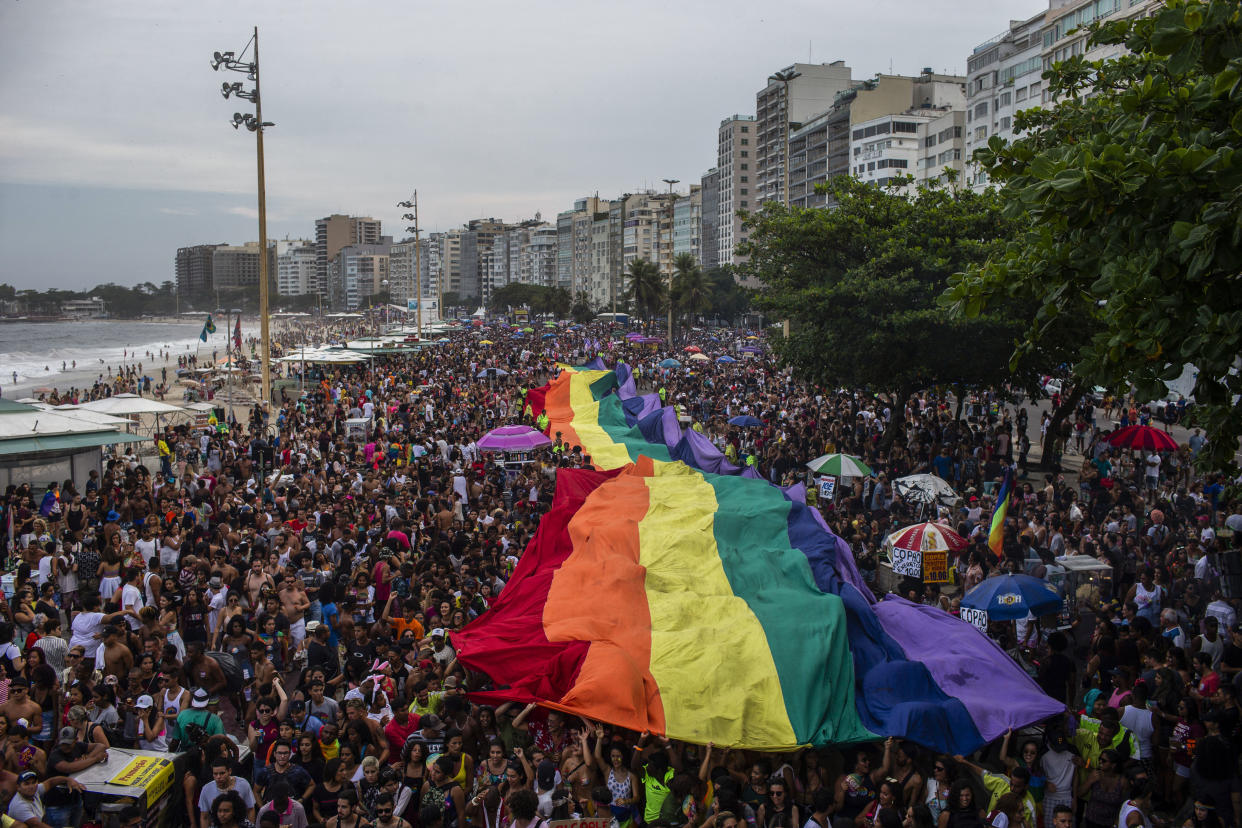 A giant rainbow flag is pictured during the Pride parade at Copacabana Beach in Rio de Janeiro, Brazil, on Sept. 30, 2018. (Photo: MAURO PIMENTEL VIA GETTY IMAGES)