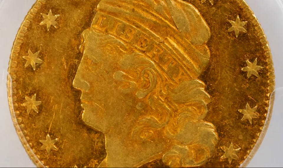 This image taken from video provided by Stack's Bowers Galleries shows a 1822 Half Eagle gold coin from the D. Brent Pogue Collection that was sold at Stack's Bowers Galleries in Las Vegas. The coin trading world has a new gold standard, after the only known 1822 half eagle $5 piece in private hands sold at auction in Las Vegas for $8.4 million, experts said Friday, March 26, 2021. (Stack's Bowers Galleries via AP)