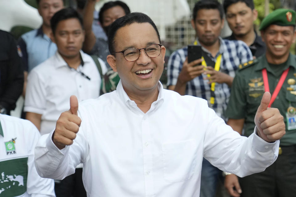 FILE - Indonesian Presidential candidate Anies Baswedan reacts as he arrives for a medical check up required for his candidacy in the upcoming presidential election, at Gatot Soebroto Army Hospital in Jakarta, Indonesia, Saturday, Oct. 21, 2023. Indonesians on Wednesday, Feb. 14, 2024 will elect the successor to popular President Joko Widodo, who is serving his second and final term. It is a three-way race for the presidency among current Defense Minister Prabowo Subianto and two former governors, Anies Baswedan and Ganjar Pranowo. (AP Photo/Achmad Ibrahim, File)