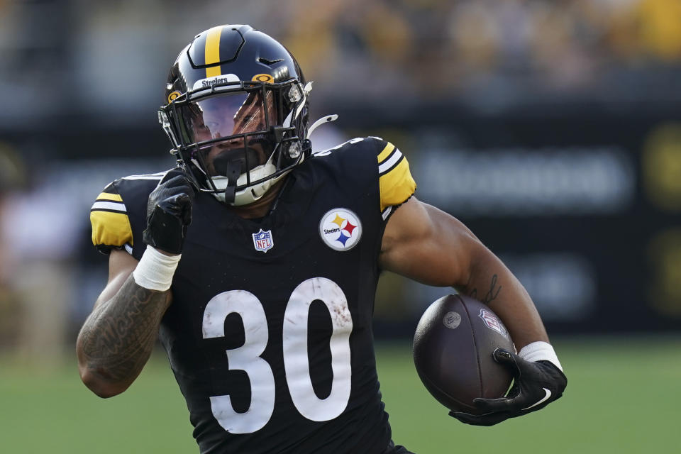 Pittsburgh Steelers running back Jaylen Warren (30) runs for a touchdown in the first half of an NFL preseason football game against the Buffalo Bills, in Pittsburgh, Saturday, Aug. 19, 2023. (AP Photo/Matt Freed)