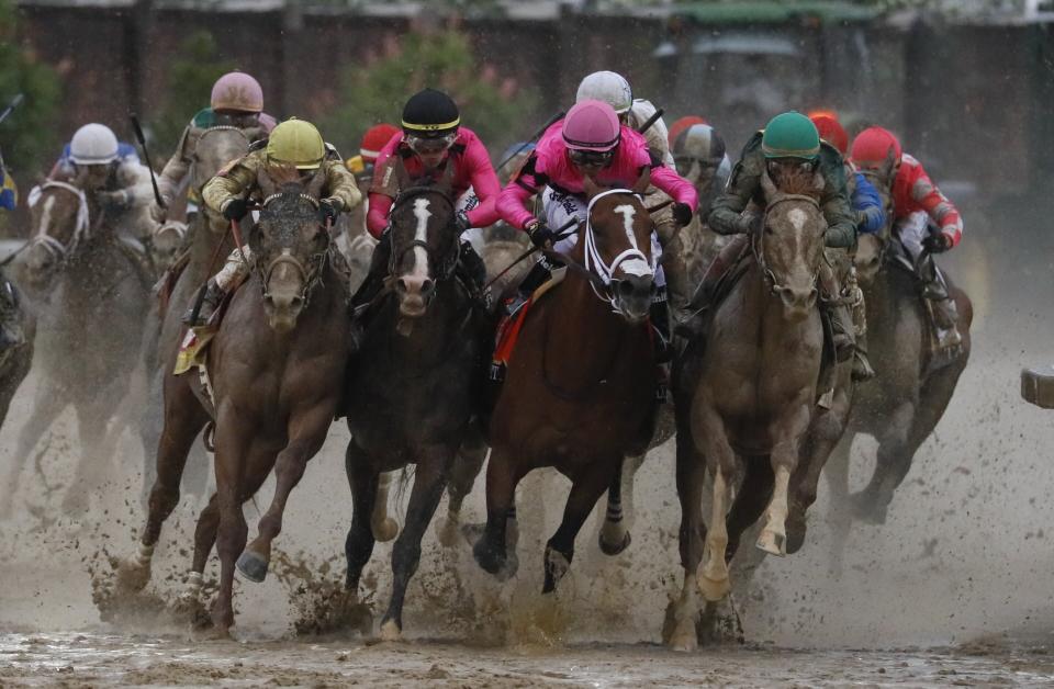 Luis Saez riding Maximum Security, second from right, goes around turn four with Flavien Prat riding Country House, left, Tyler Gaffalione riding War of Will and John Velazquez riding Code of Honor, right, during the 145th running of the Kentucky Derby horse race at Churchill Downs Saturday, May 4, 2019, in Louisville, Ky. (AP Photo/John Minchillo)