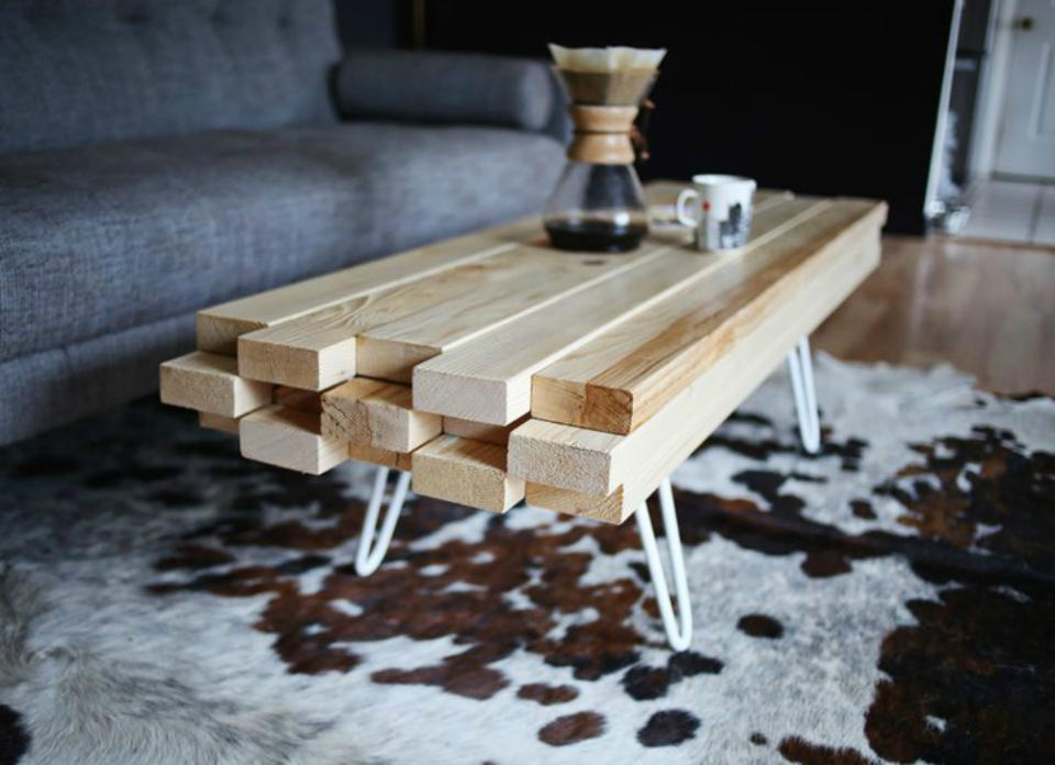<body> <p>Take a whole bunch of 2x4s and some hairpin legs, screw them all together, slap on some protective gloss, and you’ve got a super-stylish spot for coffee and cocktails (not to mention propped-up feet). Raw <a rel="nofollow noopener" href=" http://www.bobvila.com/slideshow/16-ways-to-use-salvaged-wood-in-your-home-13311#.VY1_dflViko?bv=yahoo" target="_blank" data-ylk="slk:wood;elm:context_link;itc:0;sec:content-canvas" class="link ">wood</a> gives the table a hand-hewn vibe, but the boards could certainly be stained or painted for a more finished appearance.</p> <p><strong>Related: <a rel="nofollow noopener" href=" http://www.bobvila.com/slideshow/16-designs-for-a-low-cost-diy-coffee-table-45579#.VY1--_lViko?bv=yahoo" target="_blank" data-ylk="slk:16 Designs for a Low-Cost DIY Coffee Table;elm:context_link;itc:0;sec:content-canvas" class="link ">16 Designs for a Low-Cost DIY Coffee Table</a> </strong> </p> </body>