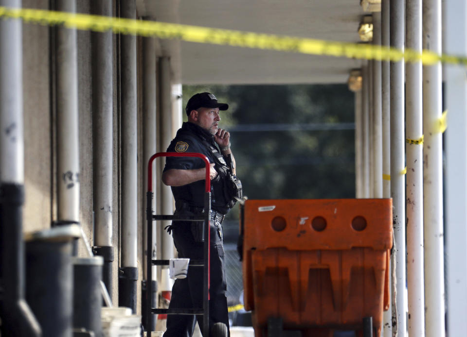 Memphis Police Department officers work the scene of a post office after a shooting, Tuesday, Oct. 12, 2021 in the Orange Mound neighborhood of Memphis, Tenn. Police investigated a shooting Tuesday at a post office in an historic neighborhood of Memphis, Tennessee, the third high-profile shooting in the region in weeks.(Patrick Lantrip/Daily Memphian via AP)