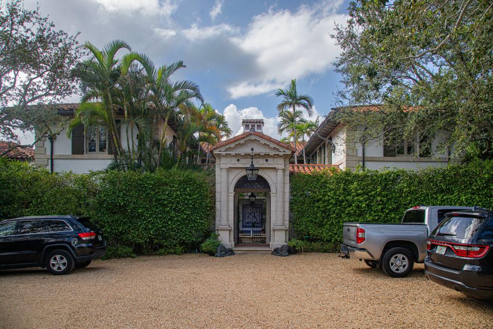 A motor court fronts the entrance to a Mediterranean-style lakefront estate at 740 Hi Mount Road in Palm Beach. Investor and entrepreneur Harvey Cooper Jones Jr. just paid a recorded $74.25 million for the property, he told the Palm Beach Daily News.