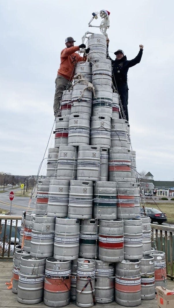 The guys at Twisted Rail Brewing get their keg tree ready for Get Lit in Canandaigua, a tree-lighting ceremony at four local breweries on Saturday evening. Young Lion, Frequentem and Peacemaker also are taking part.