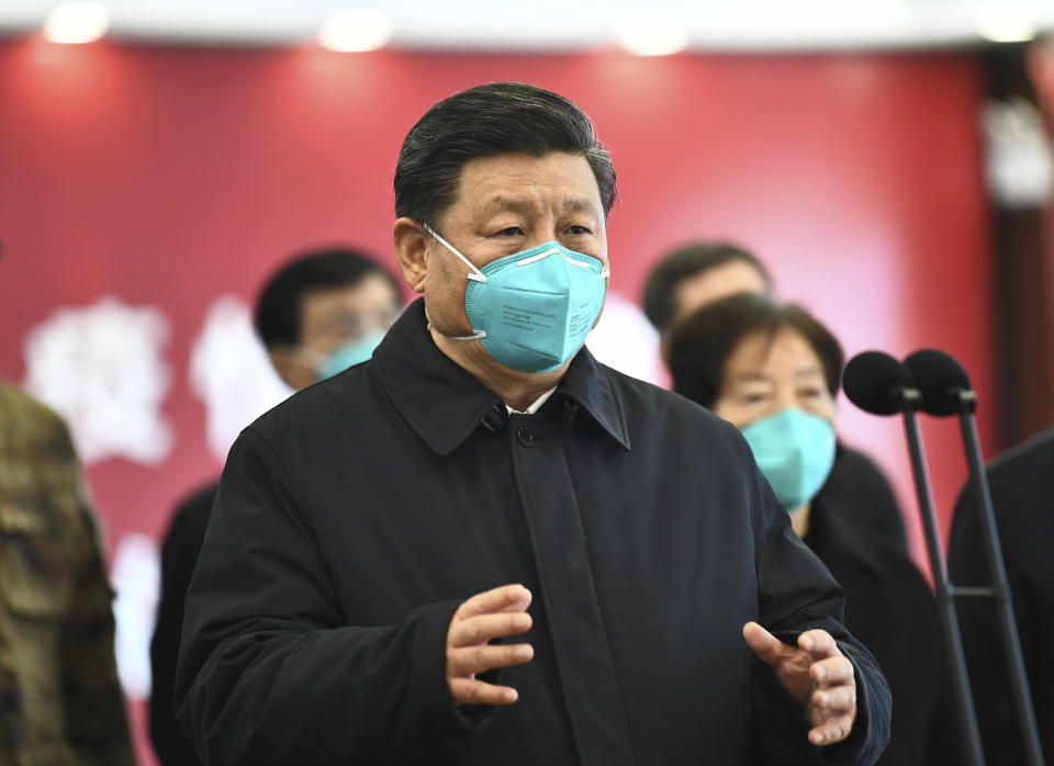 In this photo released by China's Xinhua News Agency, Chinese President Xi Jinping talks by video with patients and medical workers at the Huoshenshan Hospital in Wuhan in central China's Hubei Province, Tuesday, March 10, 2020. China's president visited the center of the global virus outbreak Tuesday as Italy began a sweeping nationwide travel ban and people worldwide braced for the possibility of recession. For most people, the new coronavirus causes only mild or moderate symptoms, such as fever and cough. For some, especially older adults and people with existing health problems, it can cause more severe illness, including pneumonia. (Xie Huanchi/Xinhua via AP)