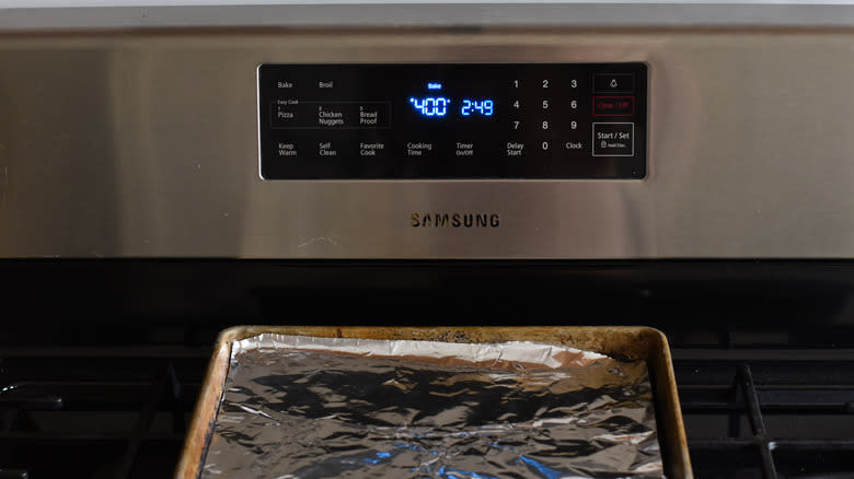 oven preheating with baking tray