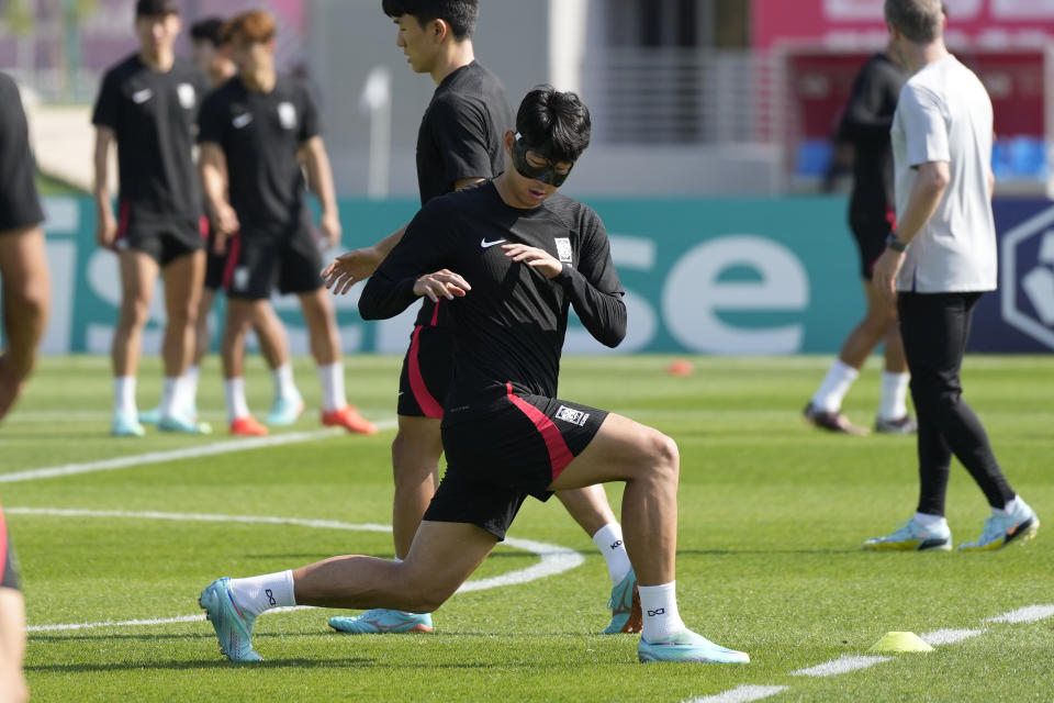 South Korea's Son Heung-min warms up during the South Korea's official training on the eve of the World Cup round of 16 soccer match between Brazil and South Korea at the Al Egla Training Site 5 in Doha, Qatar, Sunday, Dec. 4, 2022. (AP Photo/Lee Jin-man)