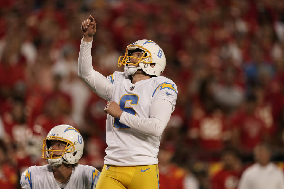 Los Angeles Chargers place kicker Dustin Hopkins watches his field goal during the first half of an NFL football game against the Kansas City Chiefs Thursday, Sept. 15, 2022, in Kansas City, Mo. (AP Photo/Charlie Riedel)