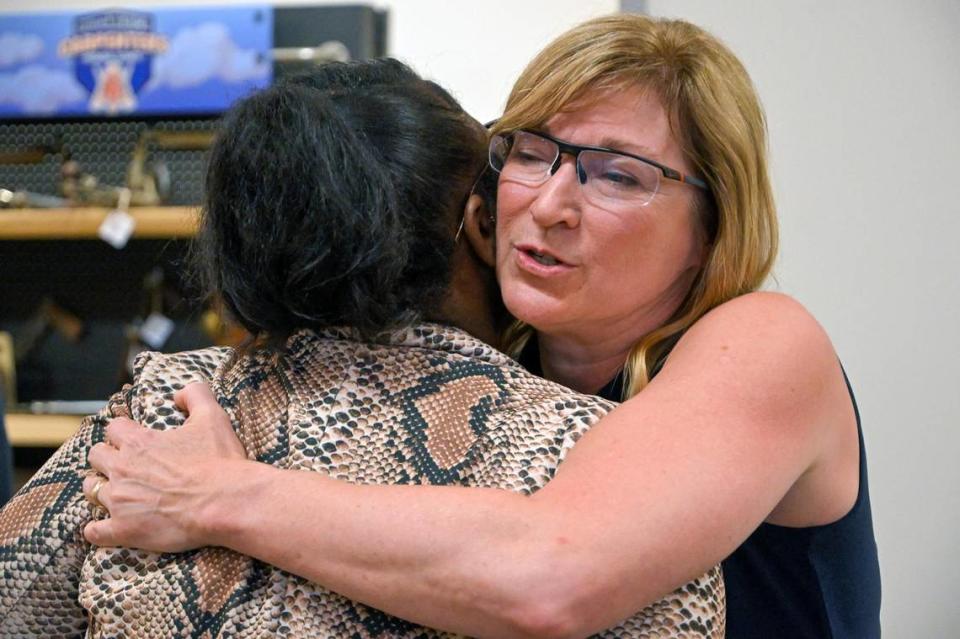 Ashli Turner hugs Jackson County Prosecutor Jean Peters Baker, who announced she will not seek re-election when her term ends in 2024.. Peters Baker has been prosecutor since 2011. Peters Baker made the announcement Thursday, June 22, 2023, at Mid-America Carpenters’ Regional Council in Kansas City.