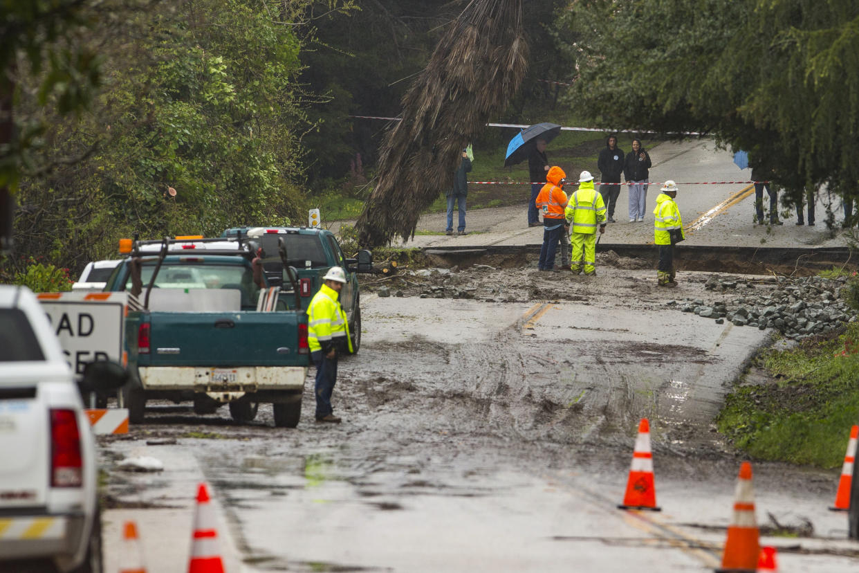 Crews assess storm damage, which washed out North Main Street in Soquel, Calif., Friday, March 10, 2023. (AP Photo/Nic Coury)