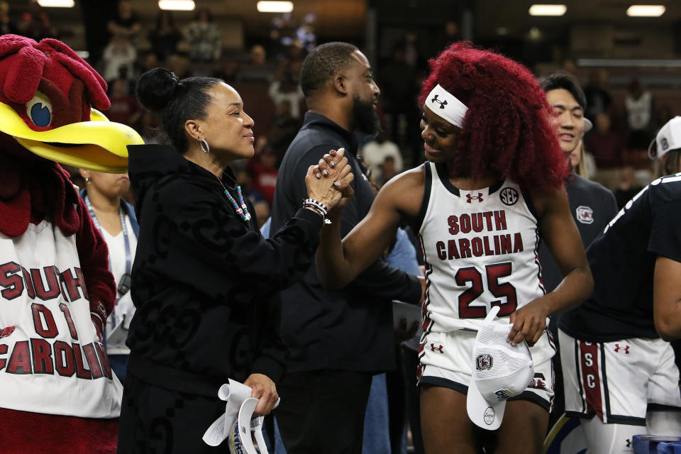 South Carolina coach Dawn Staley congratulates Raven Johnson after a win on March 10. (John Byrum/Getty Images)