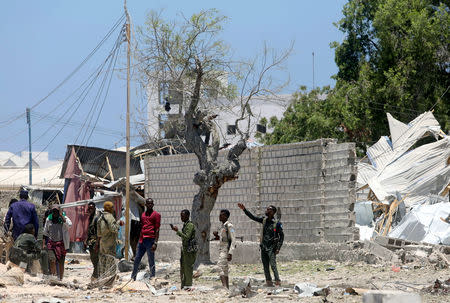 Somali security officers secure the scene after al-Shabaab militia stormed a government building in Mogadishu, Somalia March 23, 2019. REUTERS/Feisal Omar