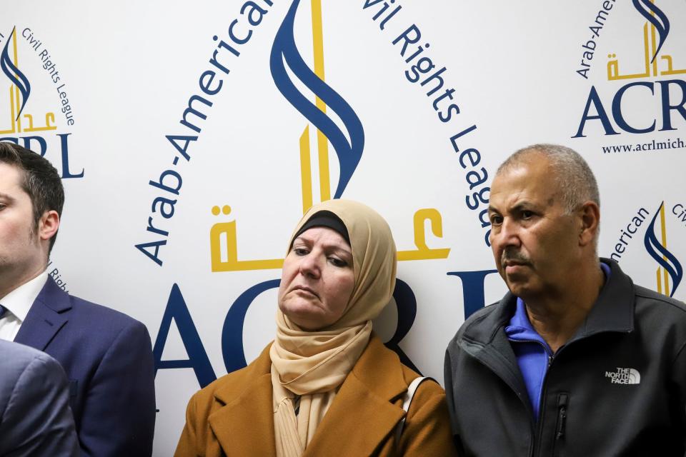 Laila Alarayshi, center, leans her head on the back wall during a press conference with her husband Zakaria Alarayshi to talk about their experiences trying to make it out of the war zone in Gaza as U.S. citizens, during a press conference held by the Arab American Civil Rights League (ACRL) at their offices in Dearborn on Wednesday, Nov. 8, 2023.