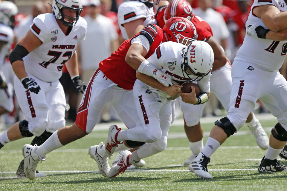 Utah defensive end Bradlee Anae, left, sacks Northern Illinois quarterback Ross Bowers, right, in the second half of an NCAA college football game Saturday, Sept. 9, 2019, Salt Lake City. (AP Photo/Rick Bowmer)