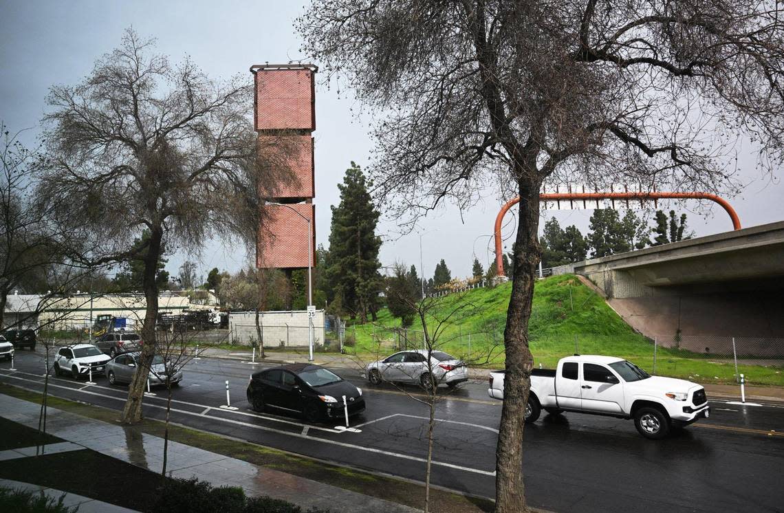Panels of brick facade cover the Verizon cell tower at R and Ventura streets, seen Friday, March 1, 2024 in downtown Fresno. The tower, which is adjacent to the State Route 41 freeway and highly visible, was originally to resemble an artificial tree.