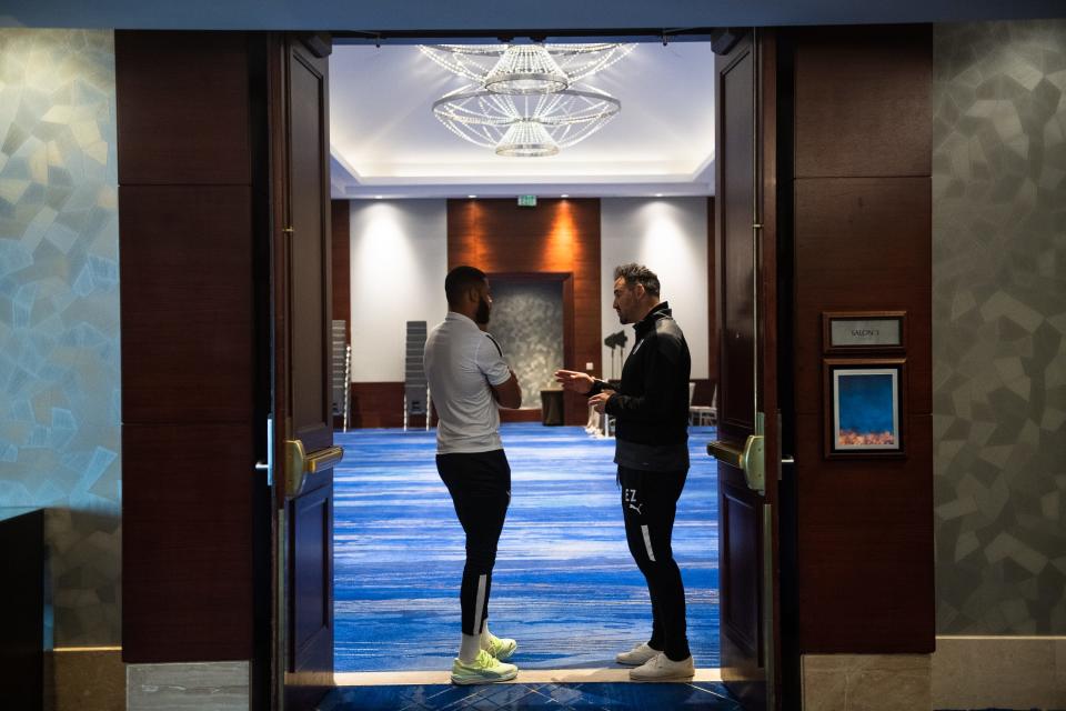Hailstorm FC head coach Éamon Zayed, right, speaks with Bruno Rendon during a team lunch at the Ritz-Carlton before a U.S. Open Cup third-round soccer match against the Colorado Rapids on Wednesday in Denver.