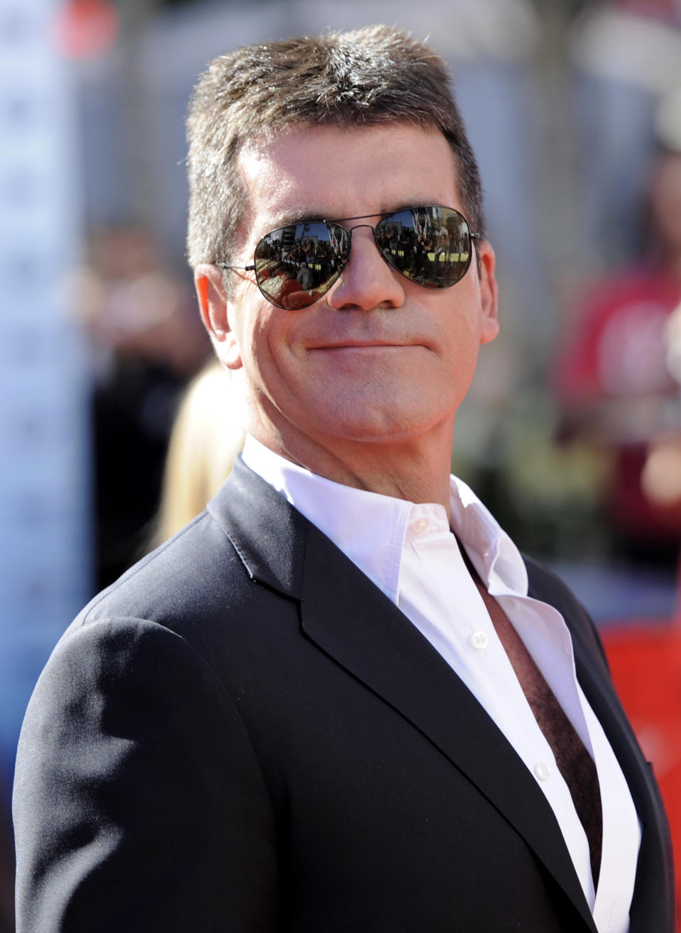 FILE - In this Wednesday, May 26, 2010 file photo British entertainment mogul Simon Cowell arrives at the "American Idol" finale in Los Angeles, US. A revealing new biography offers intimate, some might say too intimate, details about Simon Cowell, along with a portrait of the entertainment mogul's savvy business side. "Sweet Revenge," published in the U.S. by Ballantine Books on Tuesday April 21, 2012, is written by British journalist and biographer Tom Bower and is the first book written about Cowell with his participation, though not his authorization. (AP Photo/Chris Pizzello, File)