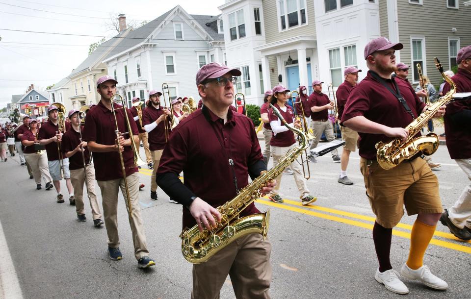 The Portsmouth High School band, with alumni and present day musicians, make their way along Islington Street during the city's 400th anniversary parade Saturday, June 3, 2023.