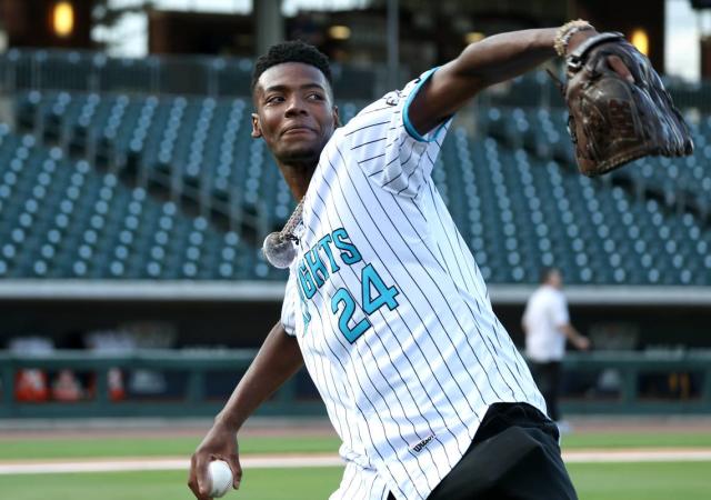 Love doing stuff with the community': Brandon Miller tosses first pitch at  Knights game
