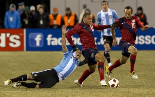 Jermaine Jones (C) of the US and Javier Mascherano (14) of Argentina fight for the ball while Landon Donovan (10) watches during the friendly match between the USA and Argentina at Giants Stadium in East Rutherford, NJ. The match ended in a 1-1 draw