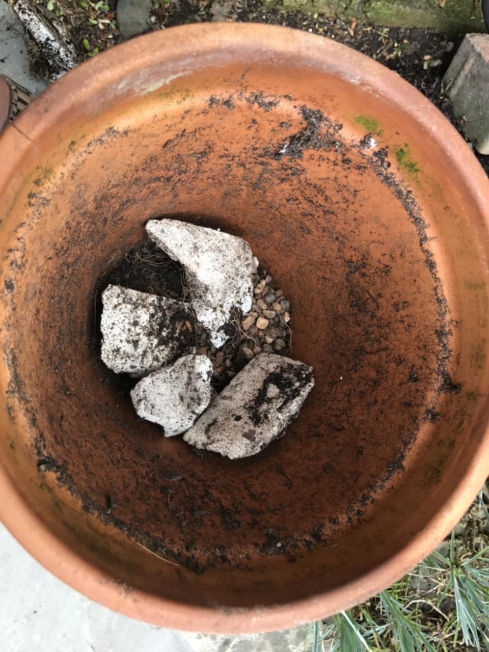 Add drainage material to pots (Hannah Stephenson/PA)