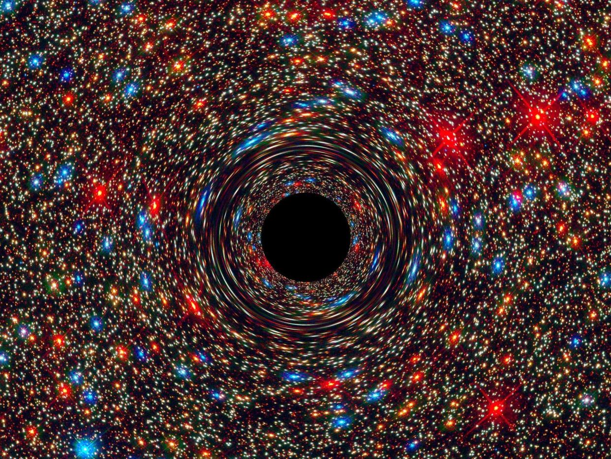 computer simulation black hole empty space in the center of a distorted ring of small colorful stars and galaxies